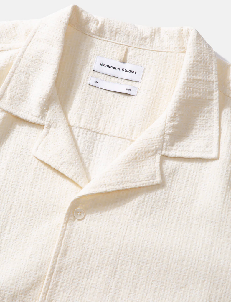 Edmmond Studios Artisan Short Sleeve Shirt in Off White - White short-sleeved shirt with textured details, crafted from 100% cotton yarn and made in Portugal.