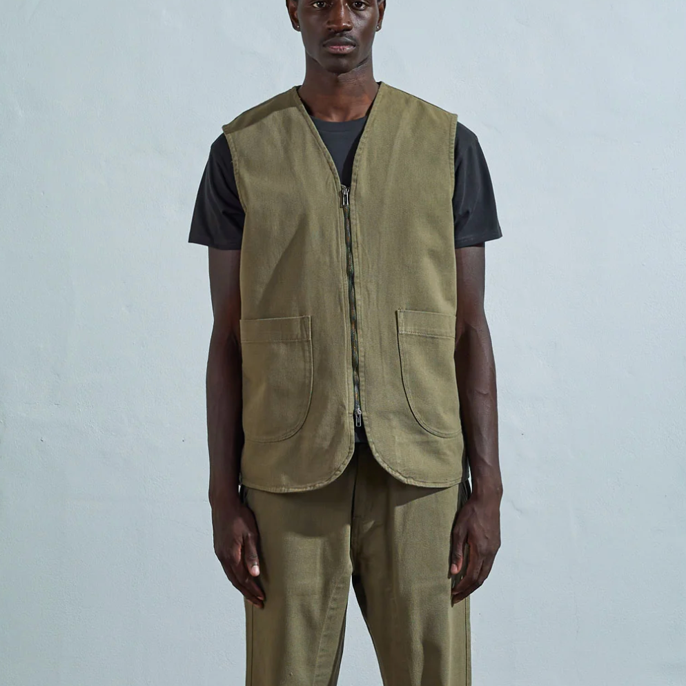 USKEES #3036 Drill Zip Up Vest in Moss - Sustainable organic cotton vest with YKK zip and front patch pockets. Modeled by Salim in medium size
