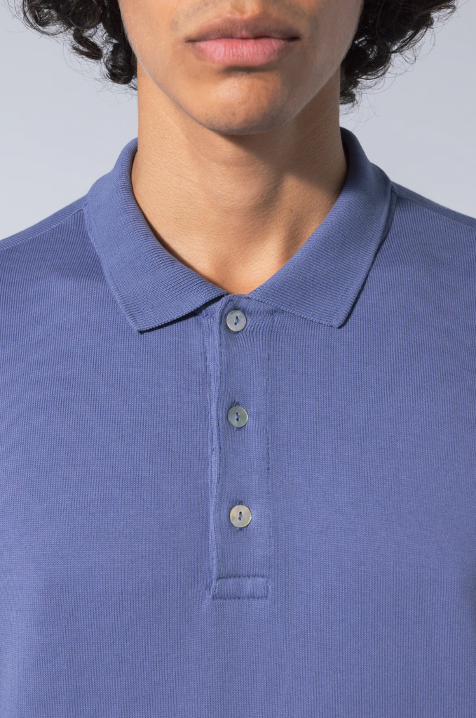 Timeless Polo Shirt: Classic silhouette crafted from 100% organic cotton with mother of pearl buttons. Made in Portugal