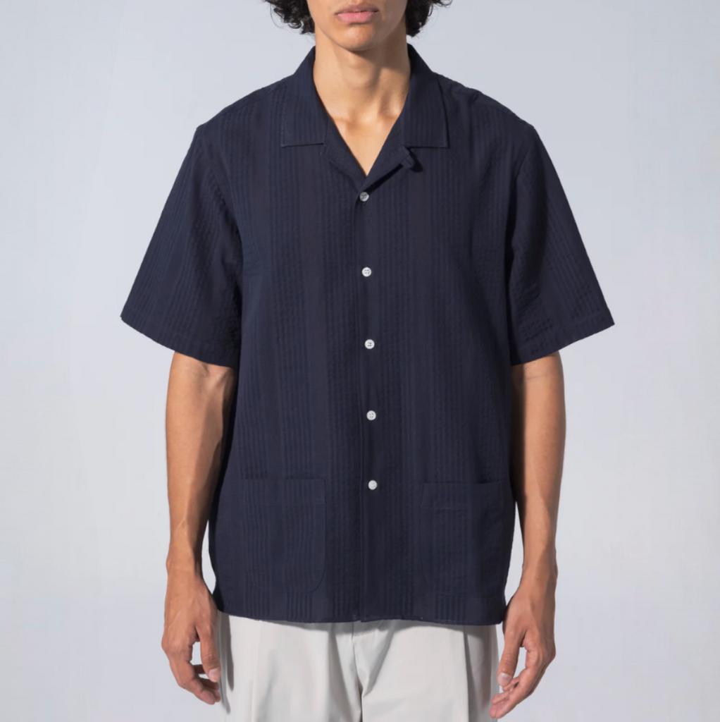 Unfeigned Short Sleeve Shirt Maui - Navy: Navy blue short sleeve shirt with mother of pearl buttons, 100% cotton fabric, and made in Spain