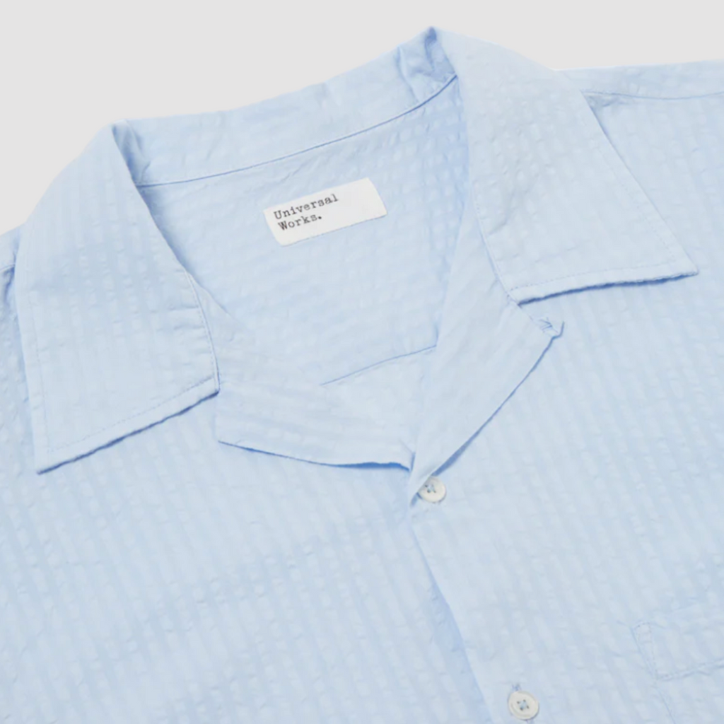 Universal Works Camp Shirt II in Pale Blue Onda Cotton: Relaxed fit shirt with modern design, crafted from lightweight, garment-dyed cotton. Perfect for summer with its comfortable feel and stylish details