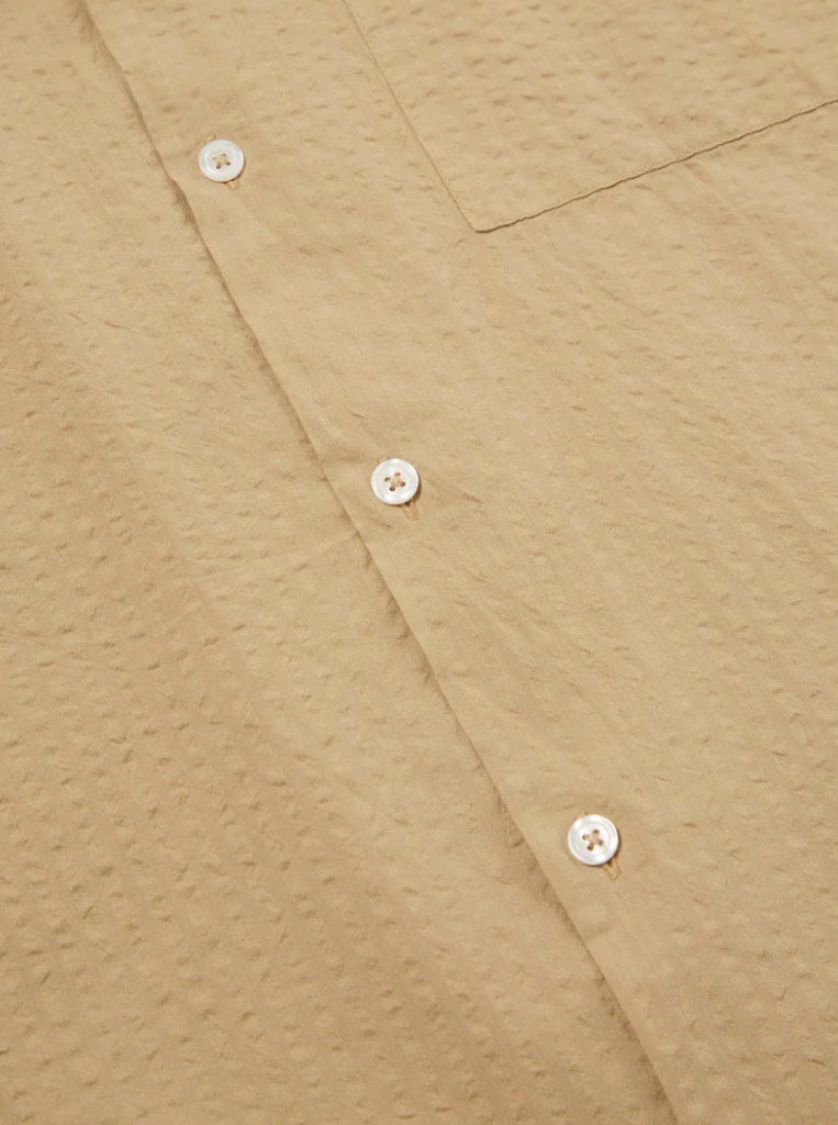 Universal Works Camp Shirt II in Summer Oak Onda Cotton: Relaxed fit shirt with modern design, crafted from lightweight, garment-dyed cotton. Ideal for summer with its comfortable feel and stylish details