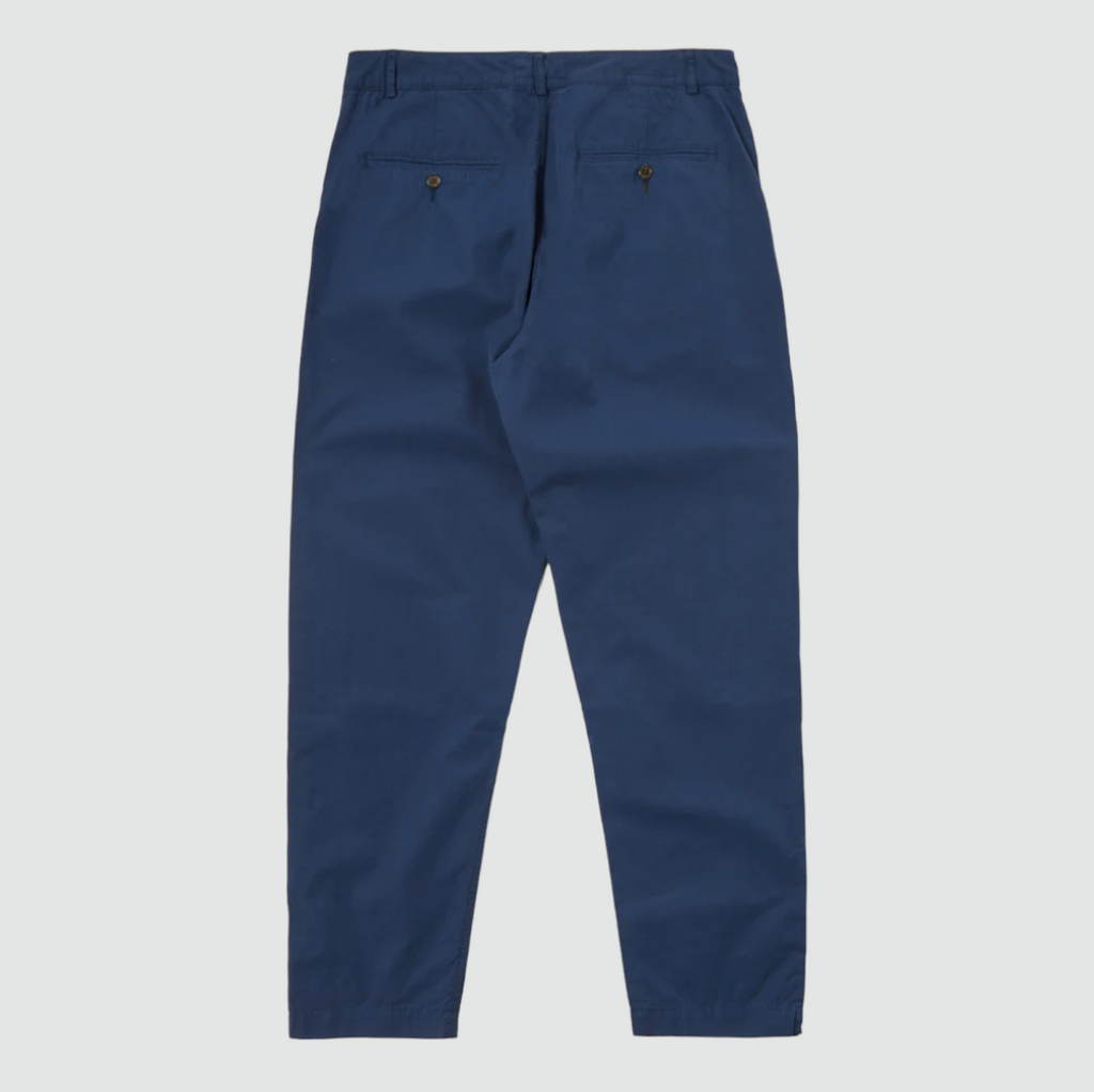 Universal Works Military Chino in Navy Summer Canvas - Comfortable loose-fit trousers crafted from durable mid-weight canvas fabric. Button fly, front and rear pockets