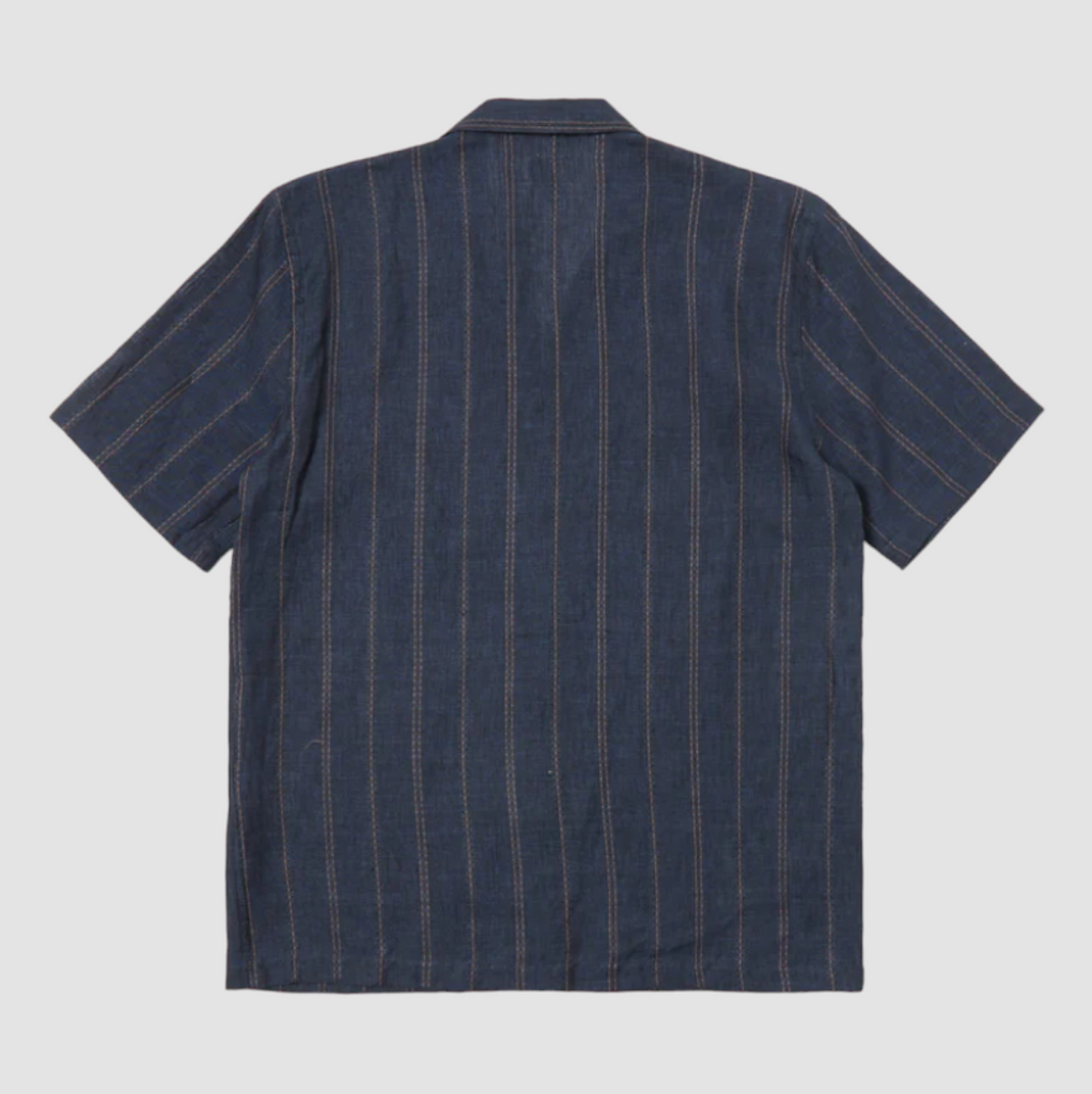 Universal Works Road Shirt in Navy Stripe Linen: Classic short-sleeved summer shirt with relaxed fit, crafted from midweight linen. Ideal for casual wear with subtle dobby stripes and single chest pocket