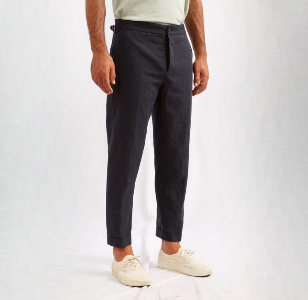 ABCL Garments Alvise Hemp Cotton Herringbone Trouser in Navy, featuring a tailored fit, flap pocket, cropped leg, adjustable waist, and real horn buttons.