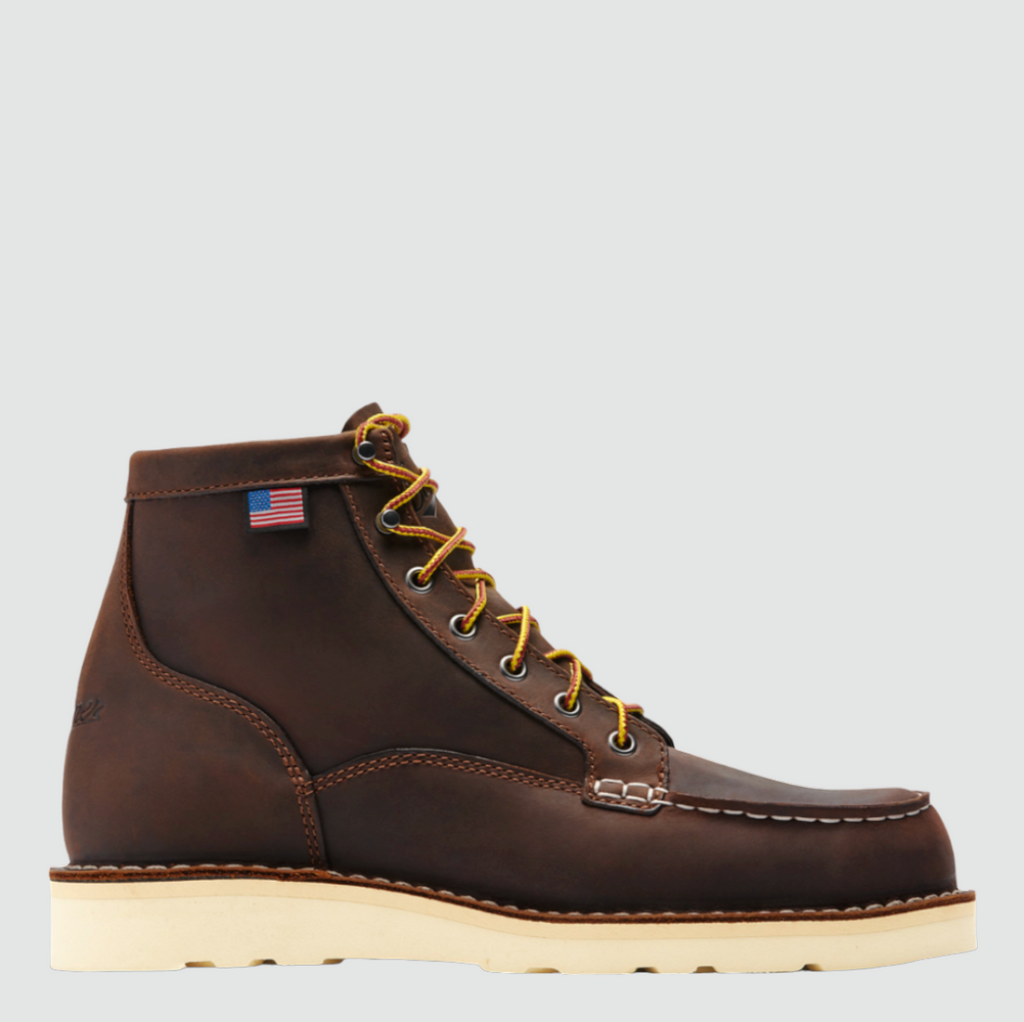 Close-up of Danner Bull Run Moc Toe work boot, featuring a durable brown leather upper, steel toe, and oil-resistant sole.