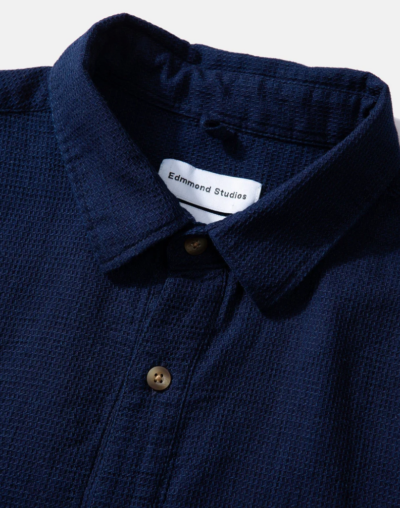 Edmmond Studios Waffle Short Sleeve Polo Shirt in Navy - Straight cut shirt with button placket, chest pocket, and buttoned cuffs, crafted from soft organic cotton waffle fabric.