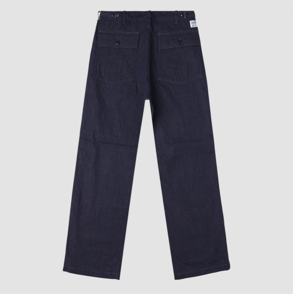 Denim baker pants on light grey background. 