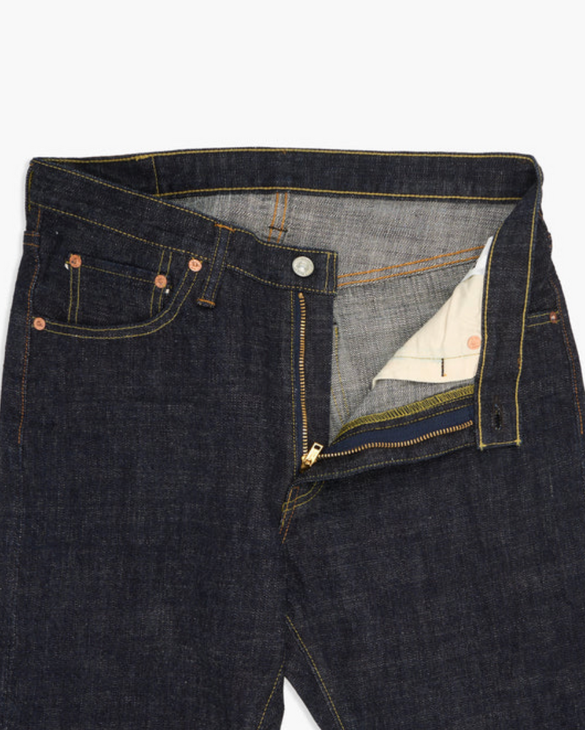 Japanese selvedge denim jeans on a light grey background.