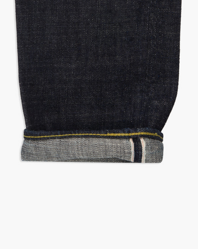 Japanese selvedge denim jeans on a light grey background.