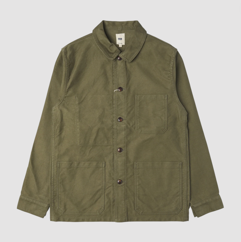 Green moleskin French jacket on a light grey background. 