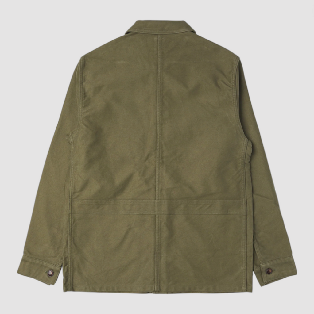 Green moleskin French jacket on a light grey background. 