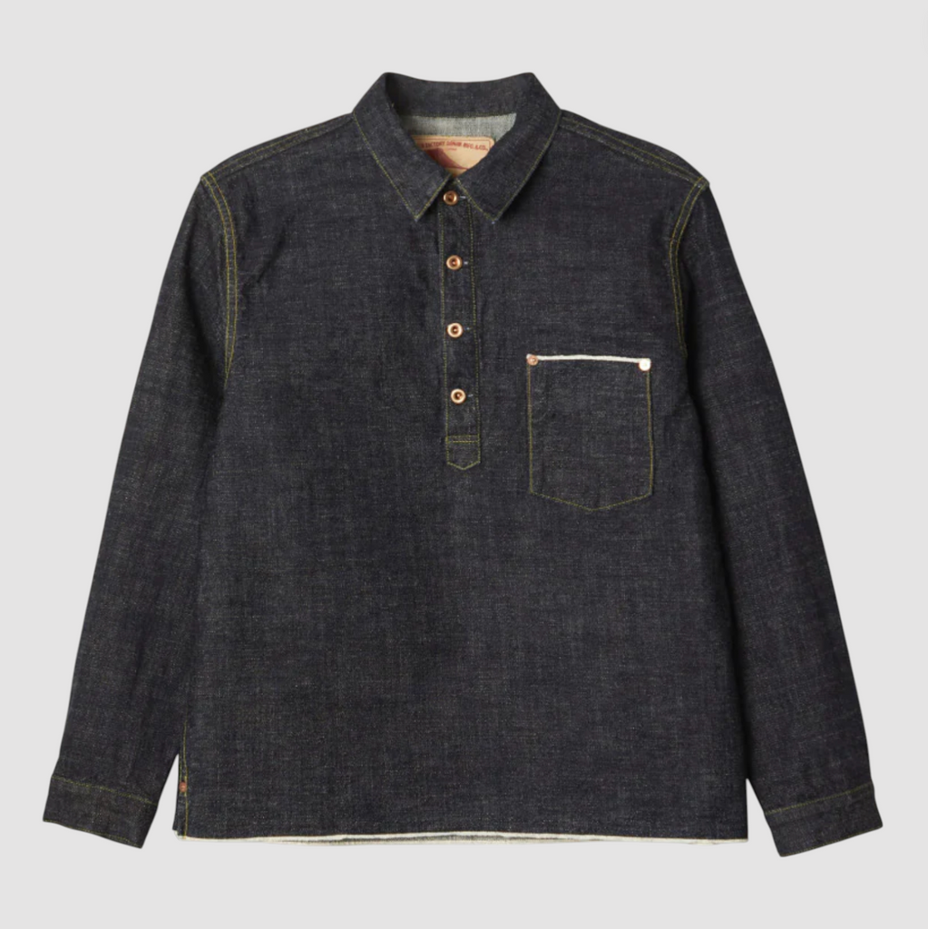 Denim pullover shirt on a light grey background. 