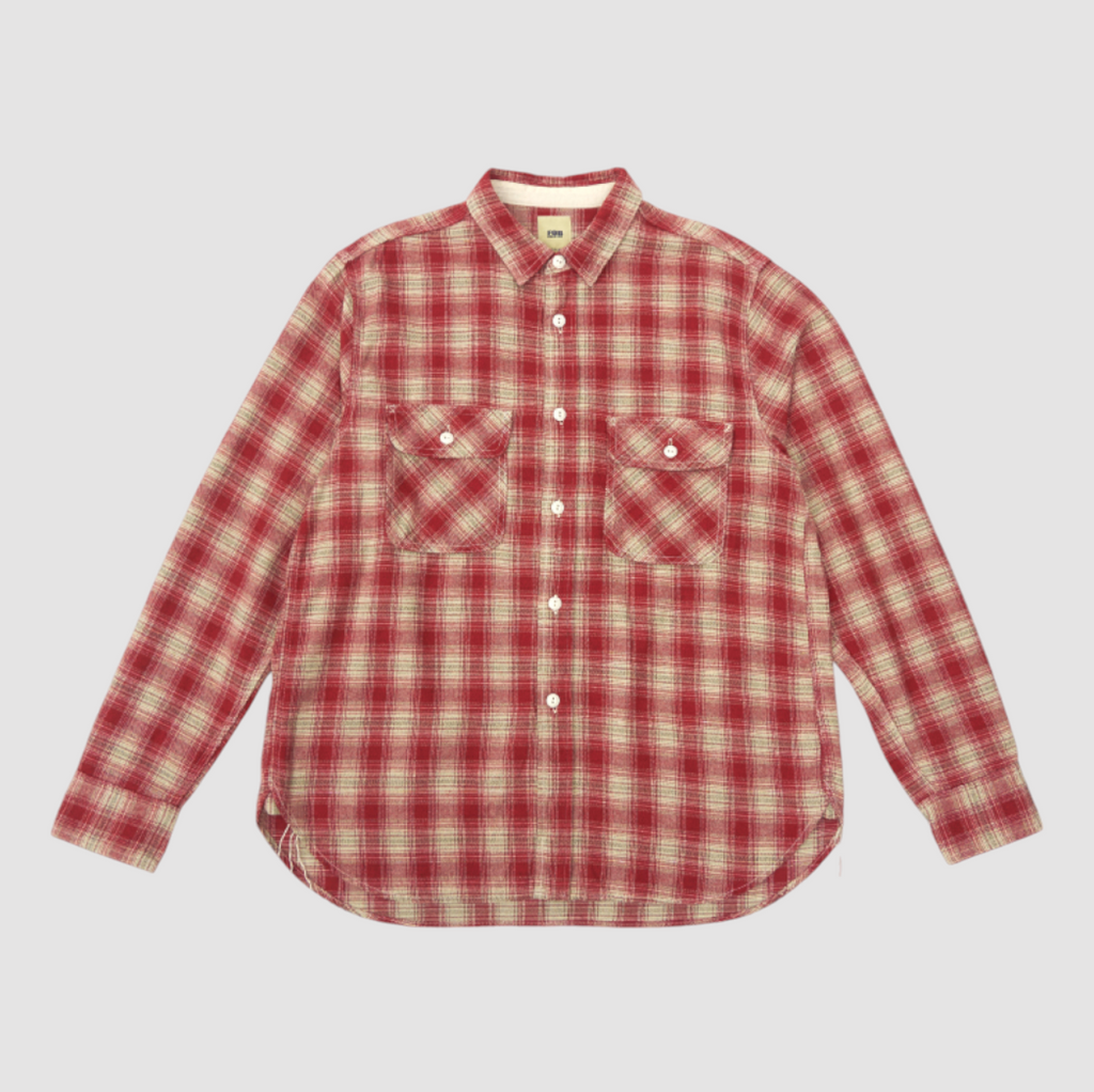 Red flannel check work shirt with twisted heathered yarn, featuring a three-dimensional texture and durable triple-needle stitching. 100% cotton.