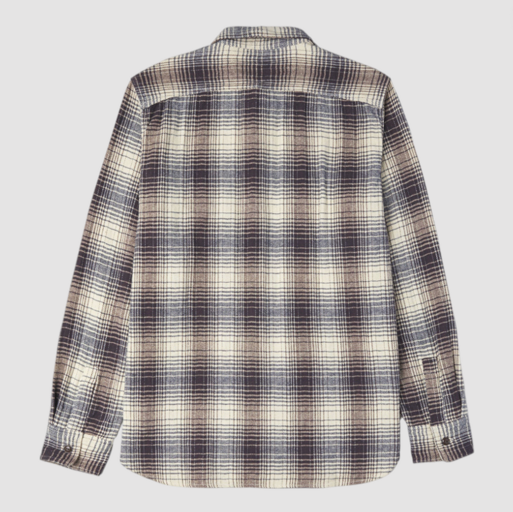 Navy and ecru checkered shirt on a light grey background. 