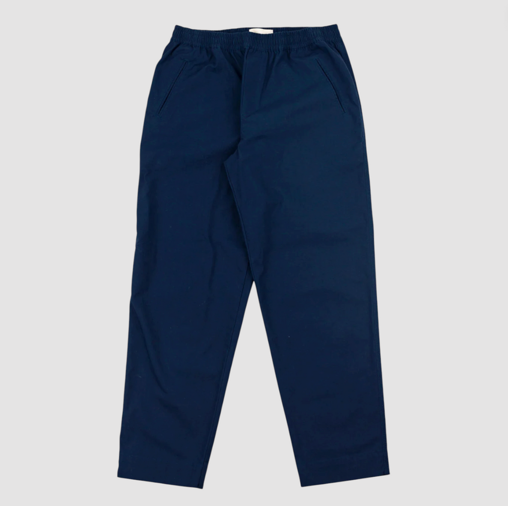 Navy blue pants on a light gray background.