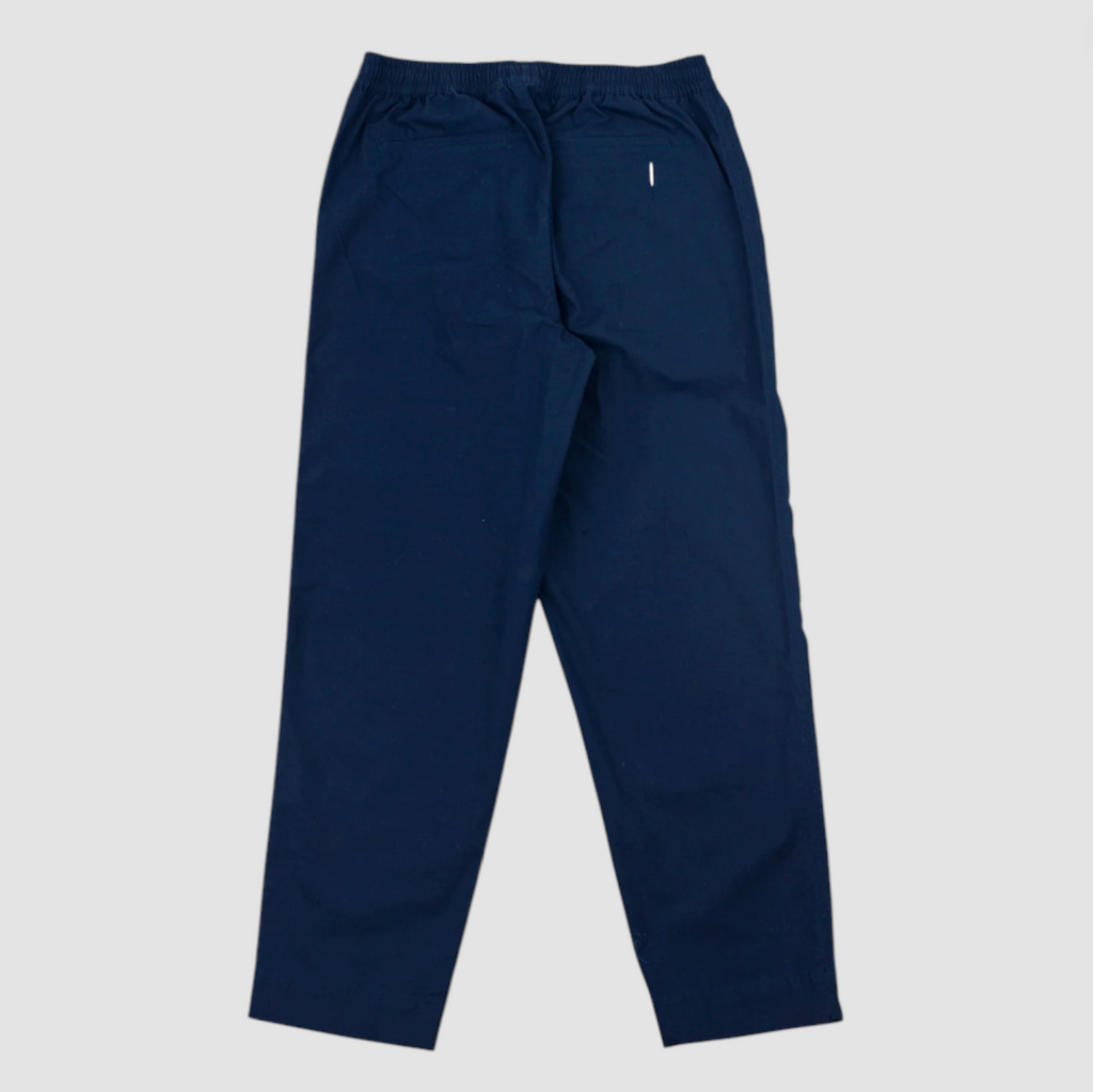 Navy blue pants on a light gray background.