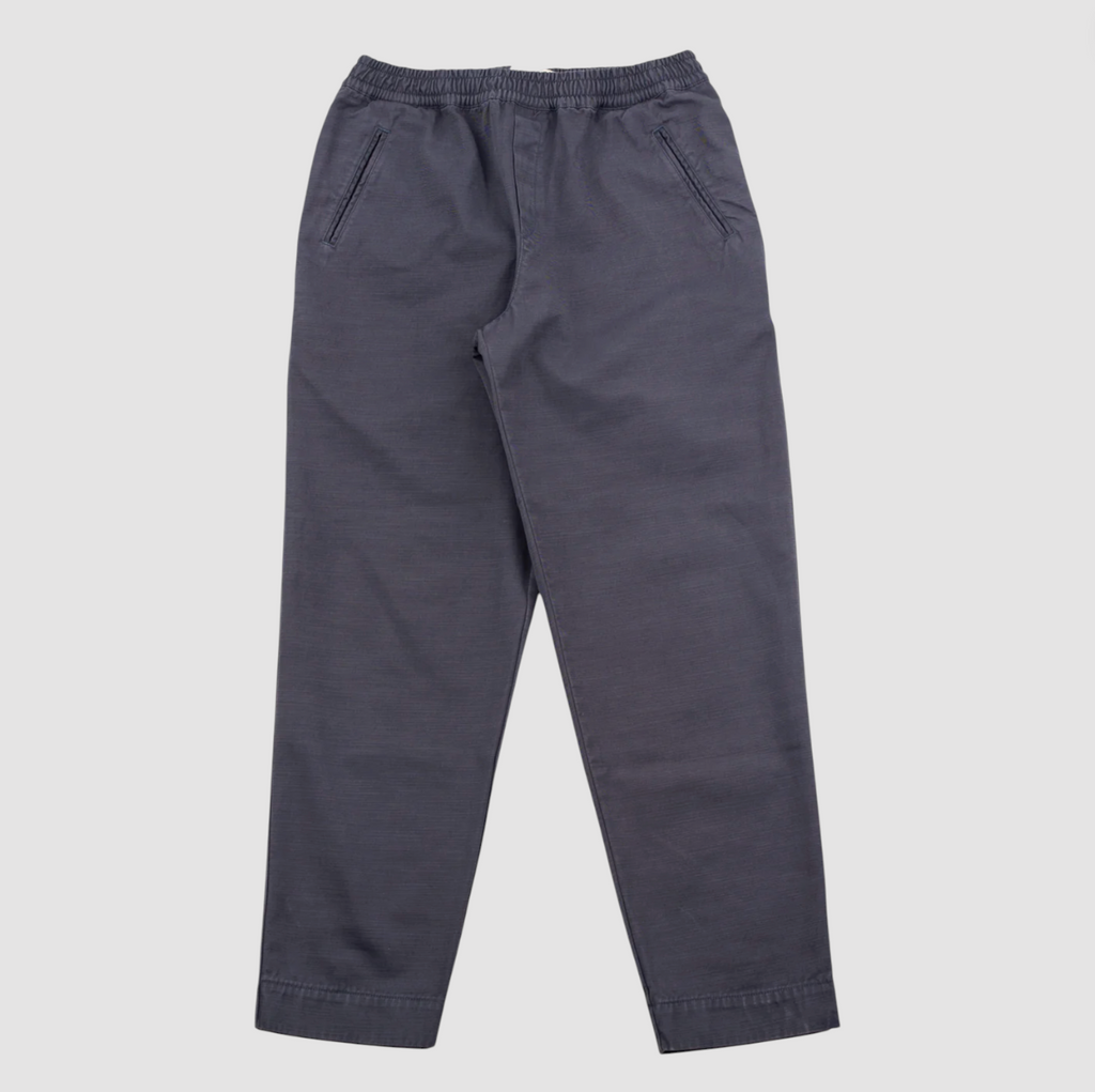 Dark gray pants on a light gray background.