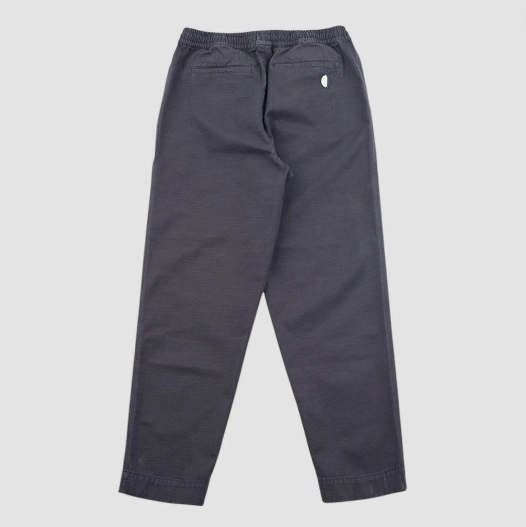 Dark gray pants on a light gray background.
