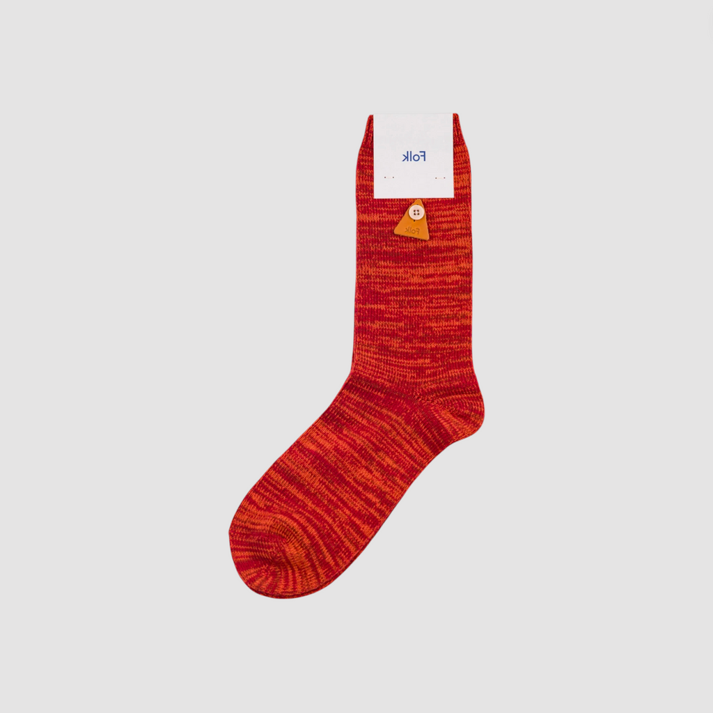 Red sock with a brand label on a light gray background.