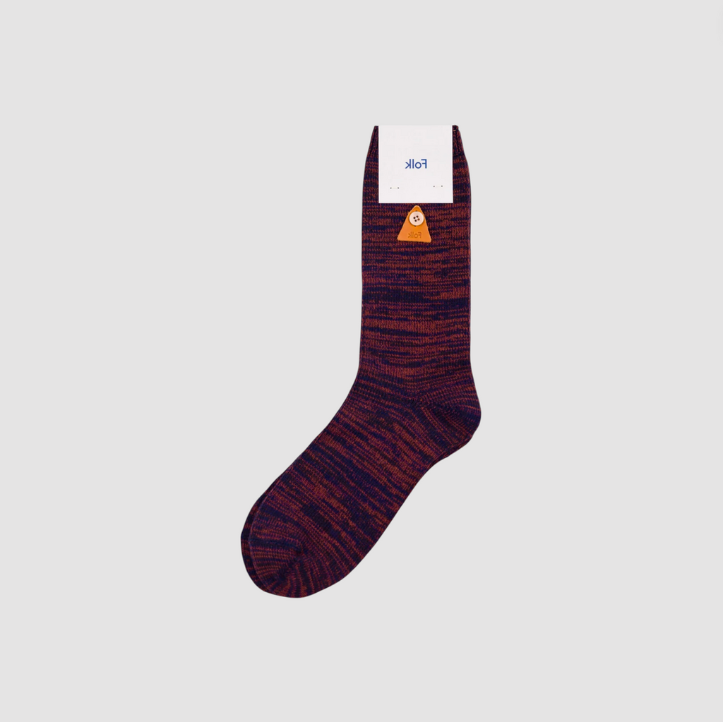 Maroon sock with a brand label on a light gray background.