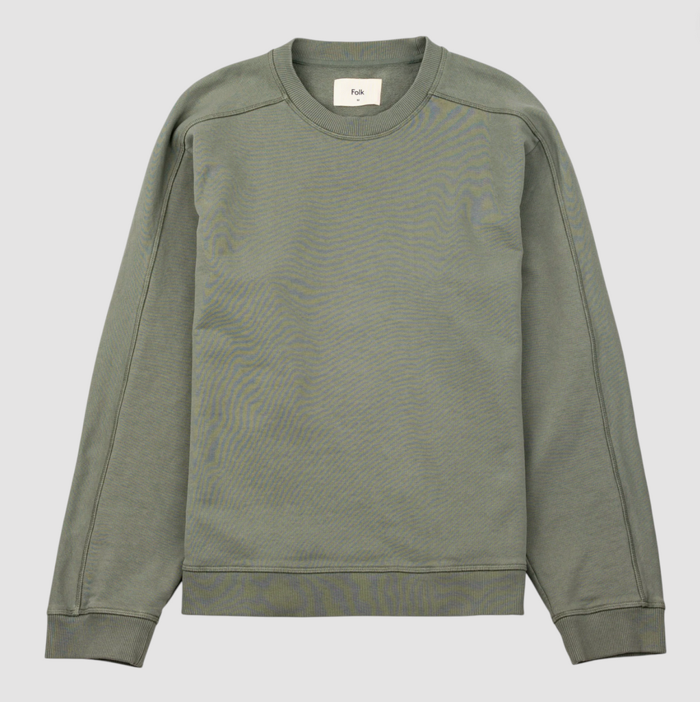 Green sweatshirt on a light gray background.
