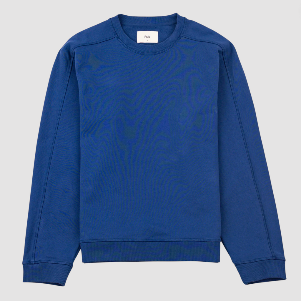 Blue sweatshirt on a light gray background.