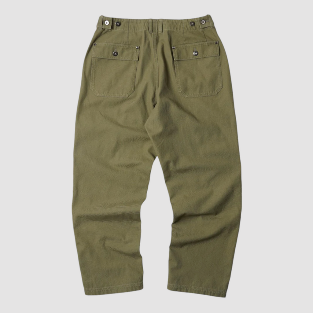 Khaki double knee work pants made from heavy-duty cotton canvas with a vintage wash and wide-leg fit. Includes rear flap pockets and rivet details.