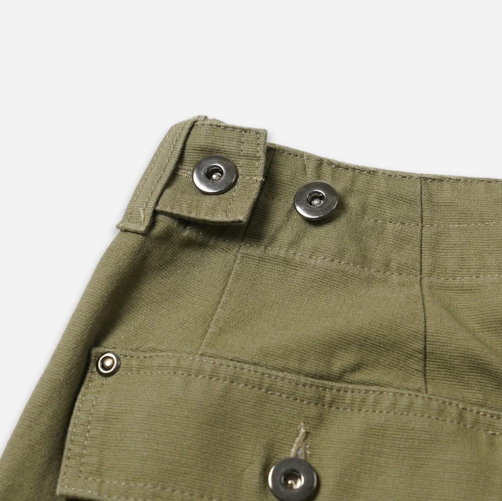 Khaki double knee work pants made from heavy-duty cotton canvas with a vintage wash and wide-leg fit. Includes rear flap pockets and rivet details.