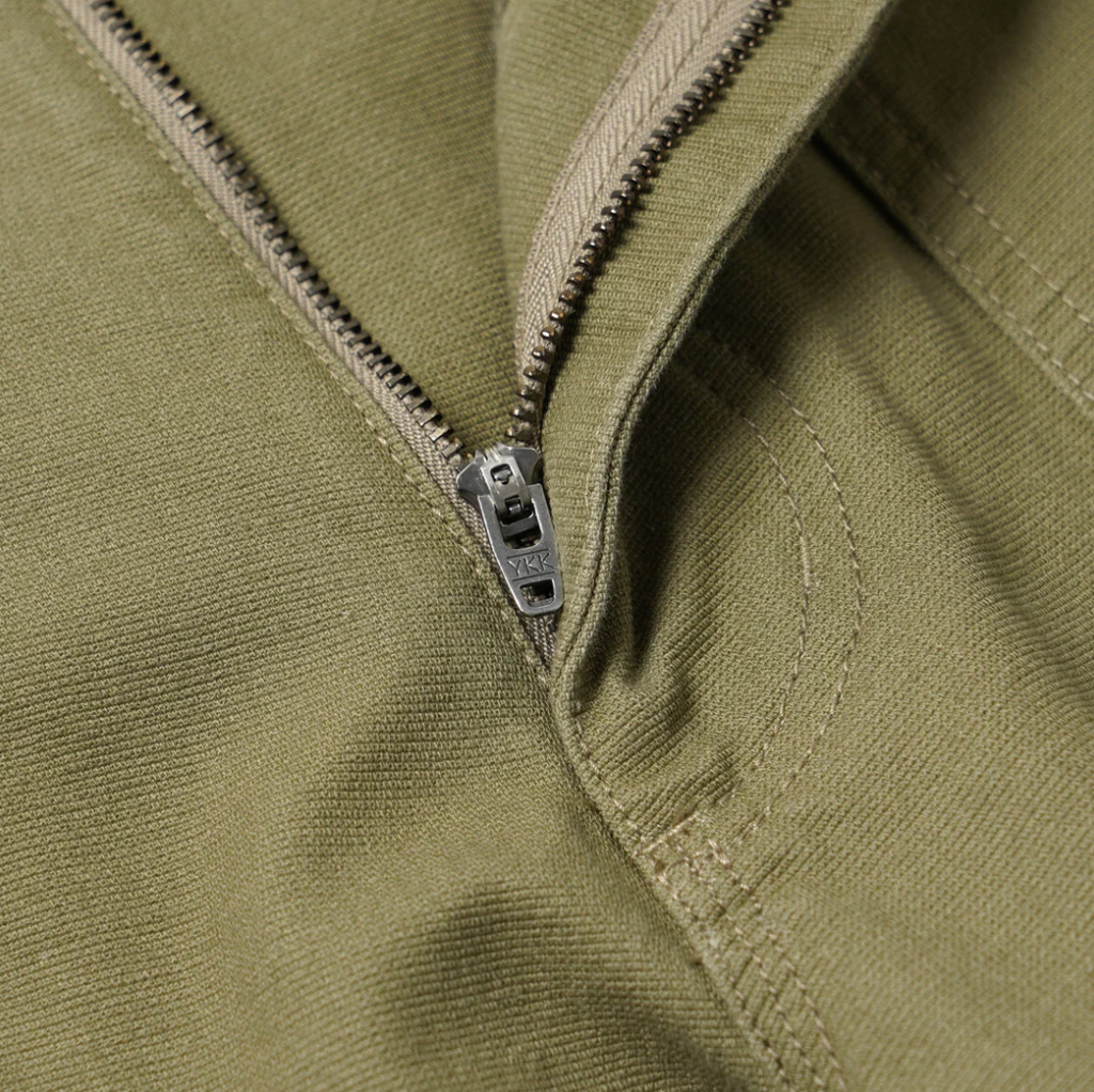 Khaki double knee work pants made from heavy-duty cotton canvas with a vintage wash and wide-leg fit. Includes rear flap pockets and rivet details.