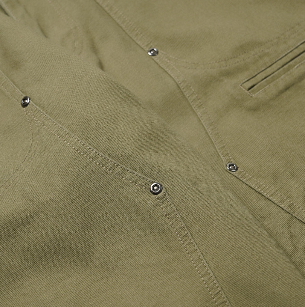 Khaki double knee work pants made from heavy-duty cotton canvas with a vintage wash and wide-leg fit. Includes rear flap pockets and rivet details.