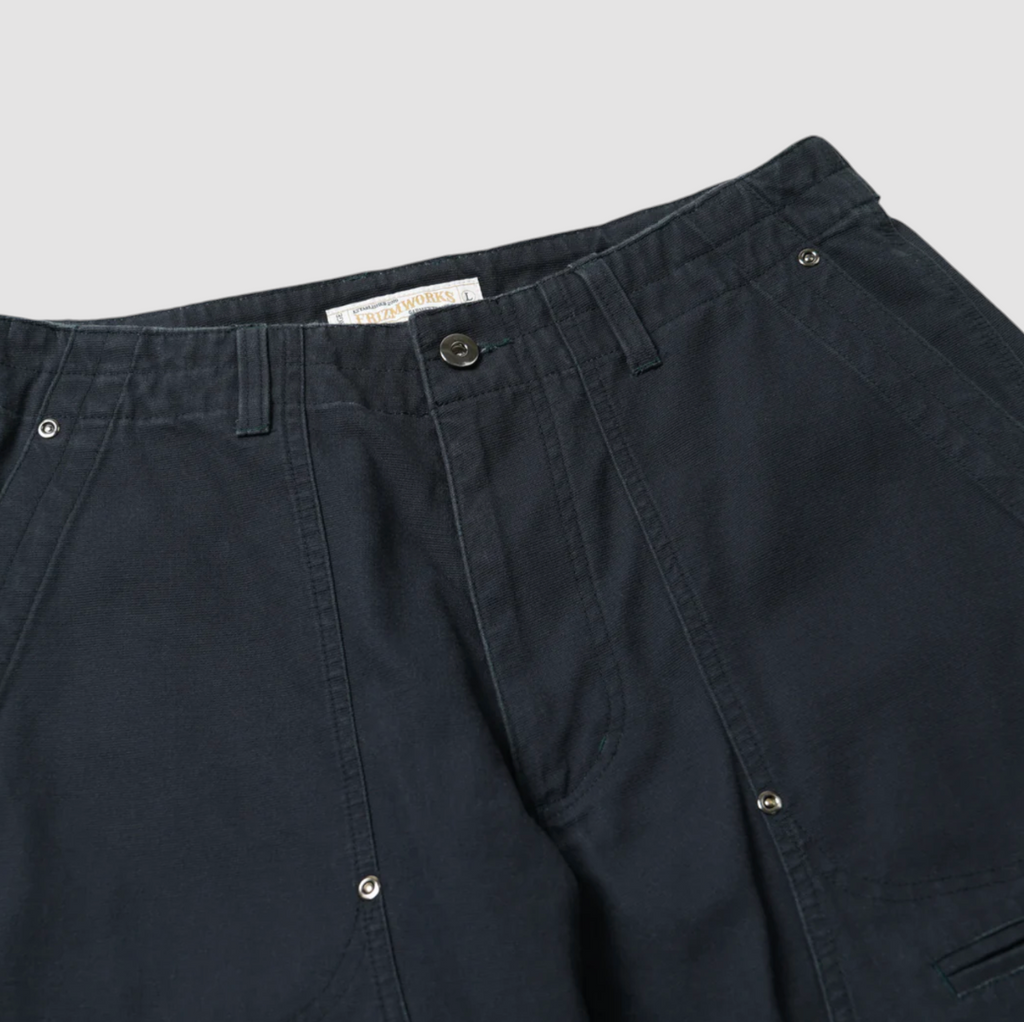 Navy double knee work pants made from durable cotton canvas with a vintage wash and wide-leg fit. Features rear flap pockets and rivet details.