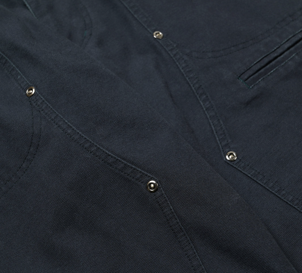 Navy double knee work pants made from durable cotton canvas with a vintage wash and wide-leg fit. Features rear flap pockets and rivet details.