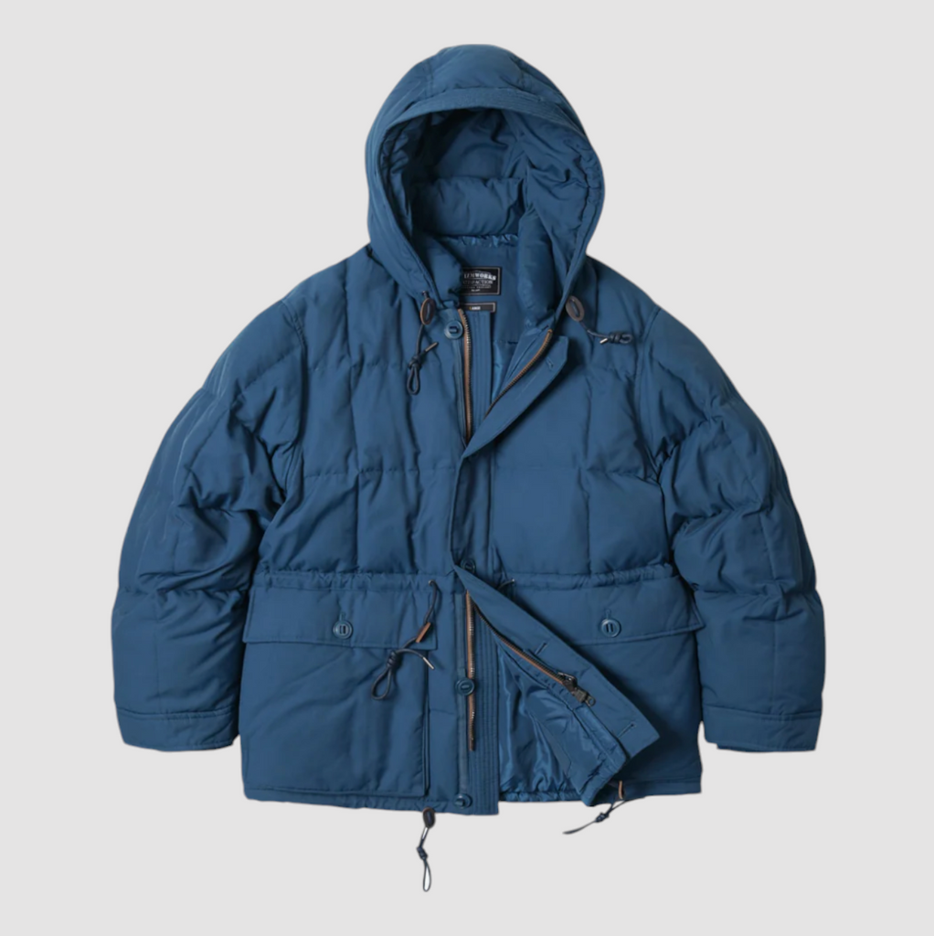 Deep blue down parka with square baffling, 60/40 fabric blend, structured hood, and 420g duck down fill. Inspired by vintage mountain parkas.