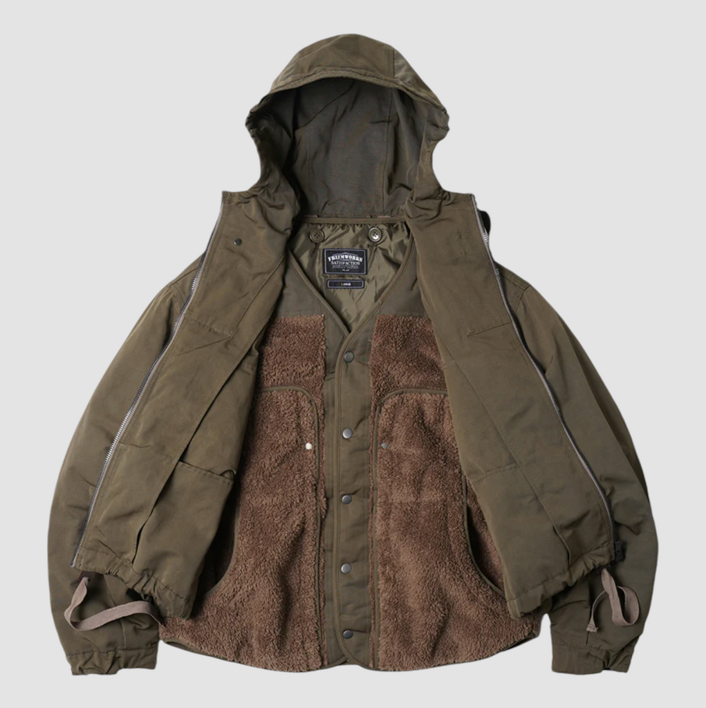 Olive 2-in-1 smock parka with detachable liner, military bellow pockets, and a relaxed, boxy fit with oversized sleeves.