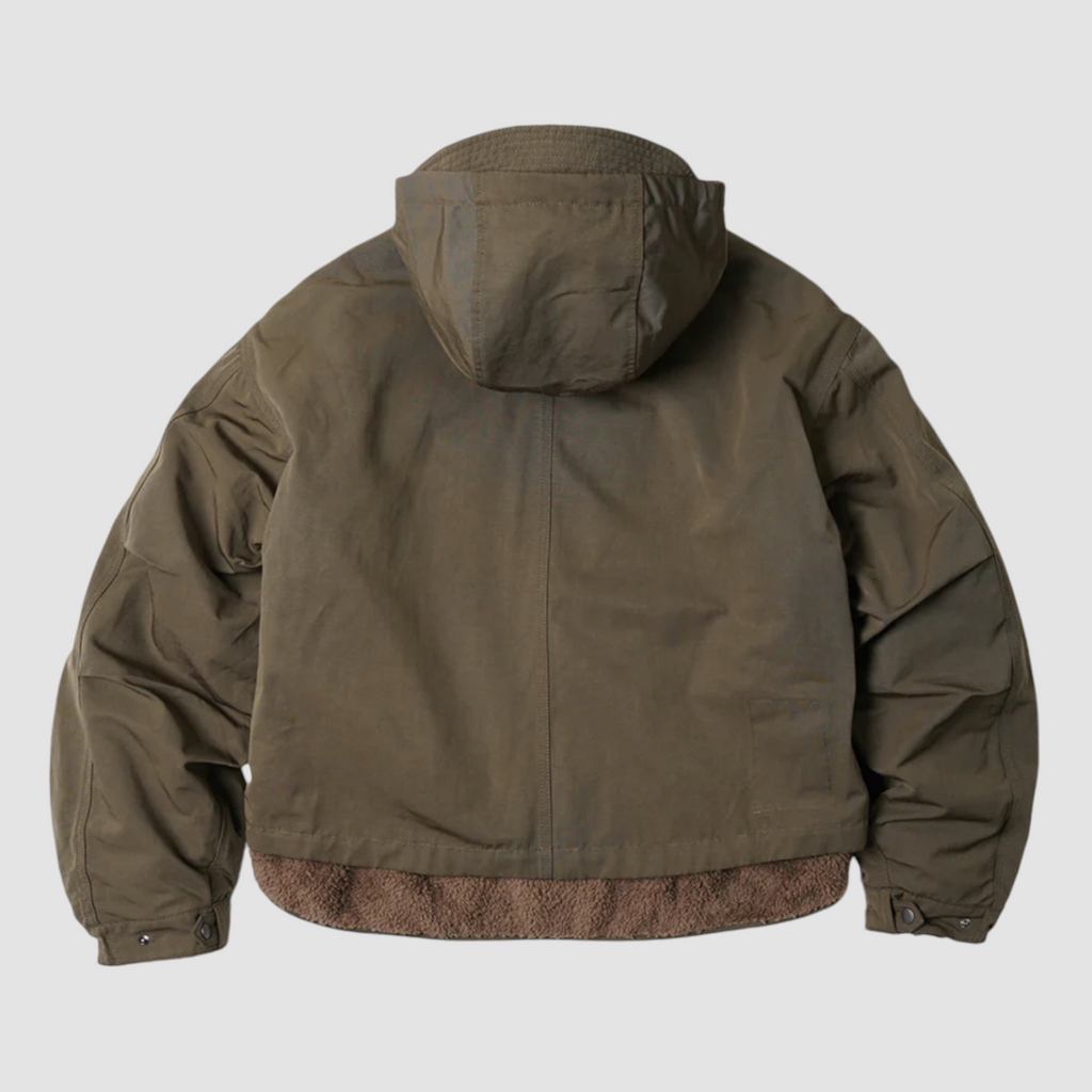 Olive 2-in-1 smock parka with detachable liner, military bellow pockets, and a relaxed, boxy fit with oversized sleeves.