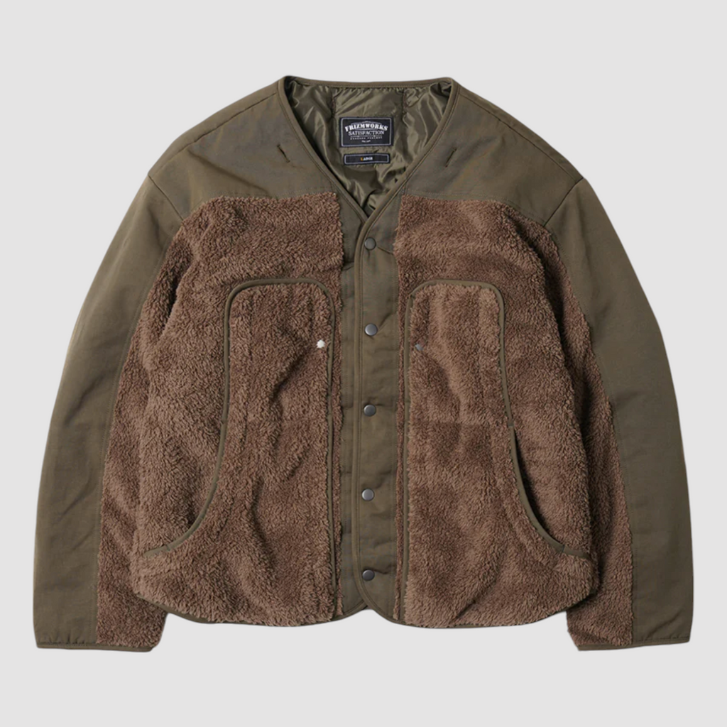 Olive 2-in-1 smock parka with detachable liner, military bellow pockets, and a relaxed, boxy fit with oversized sleeves.
