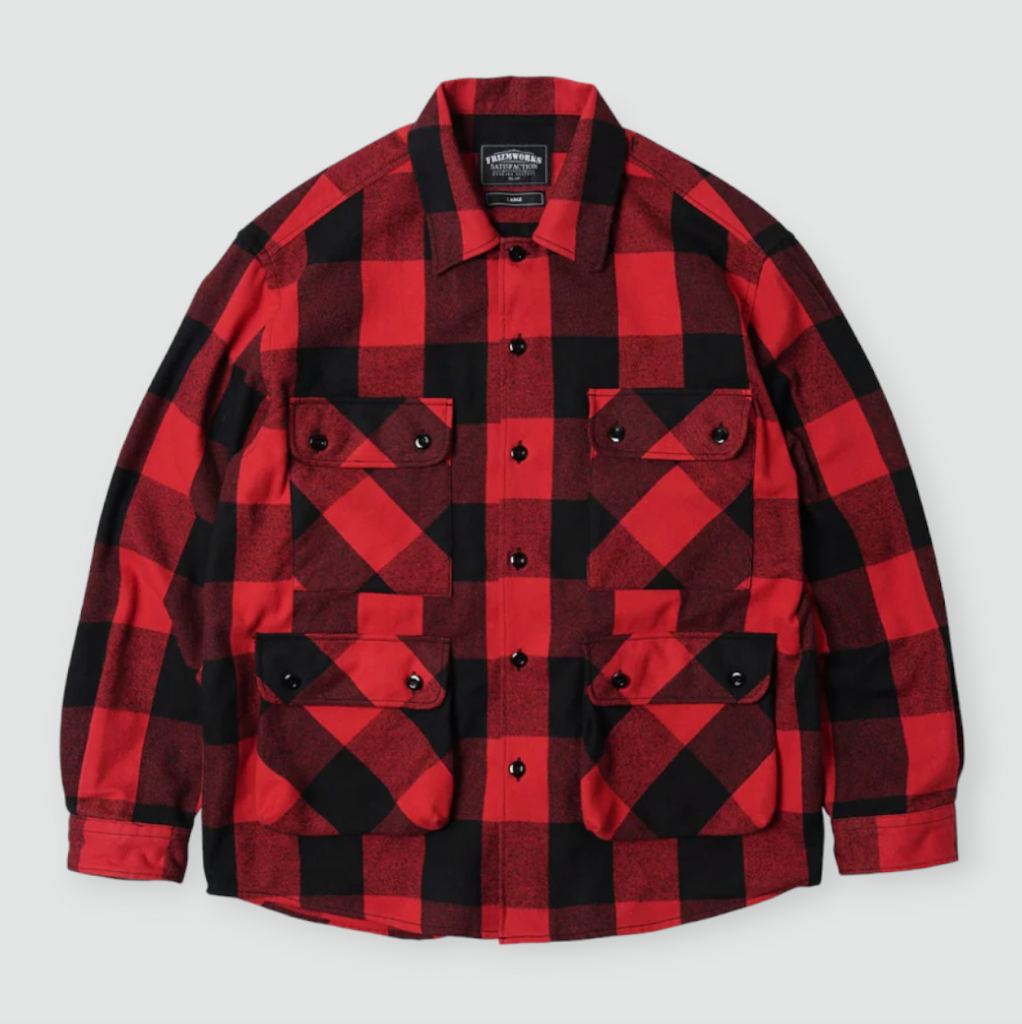 A red and black buffalo check shirt jacket with a military-inspired design, featuring four front pockets and a relaxed, oversized fit.