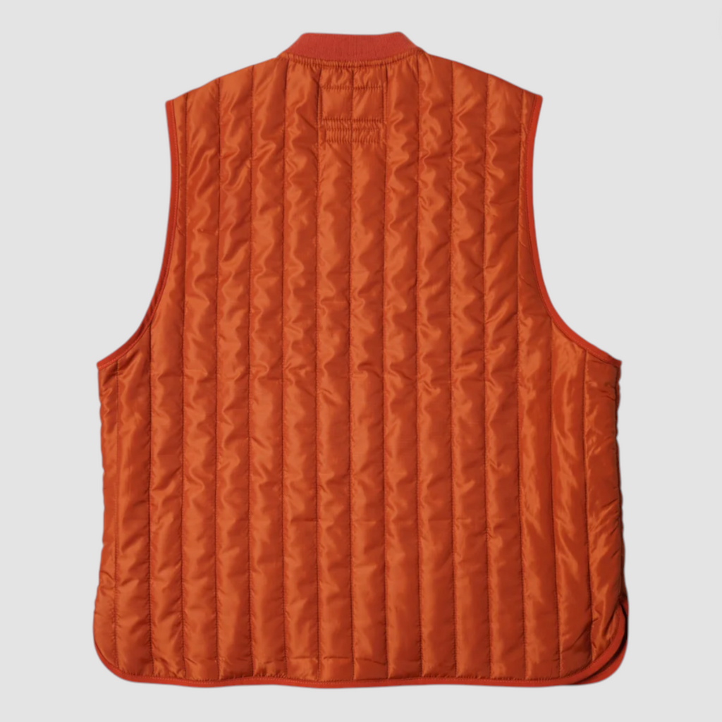 Orange quilted vest on a light gray background.
