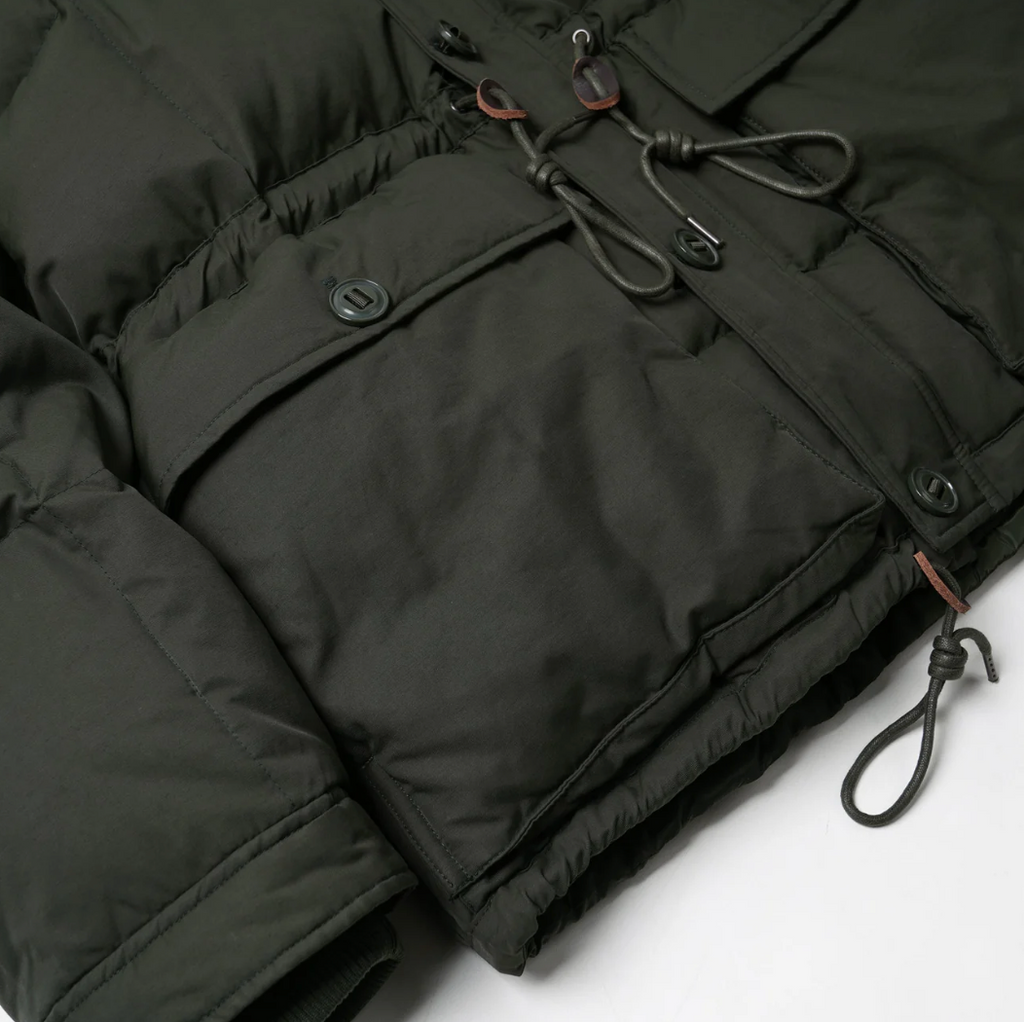 Dark green puffer jacket with drawstrings on a white background.