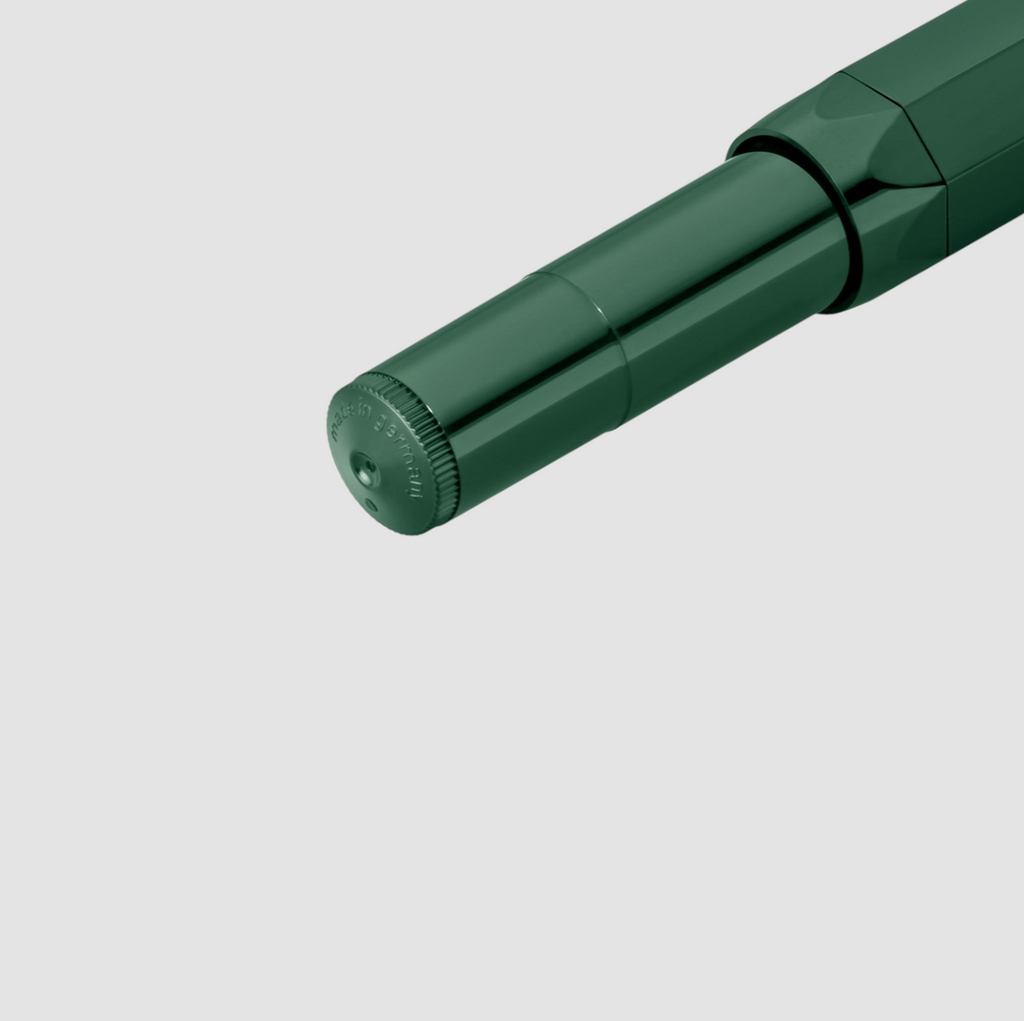 Kaweco Classic Sport Rollerball Pen in dark green, compact design with smooth ink flow and nostalgic charm.