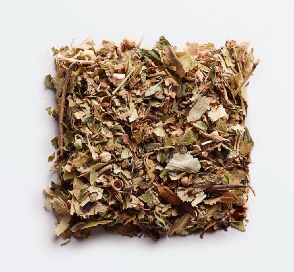 Minty herbal tea blend with premium botanicals like lemon balm, ashwagandha, and fennel, offering a grounding and relaxing flavor.