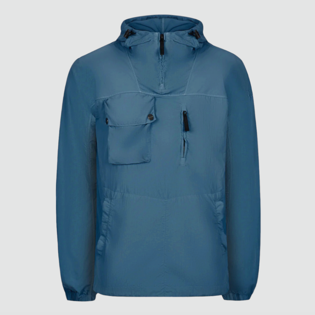 Left Hand Adda Smock in Mid Blue, featuring a recycled nylon canvas, worn-look dye treatment, adjustable hood, 3D chest pocket, and eco-friendly design details.