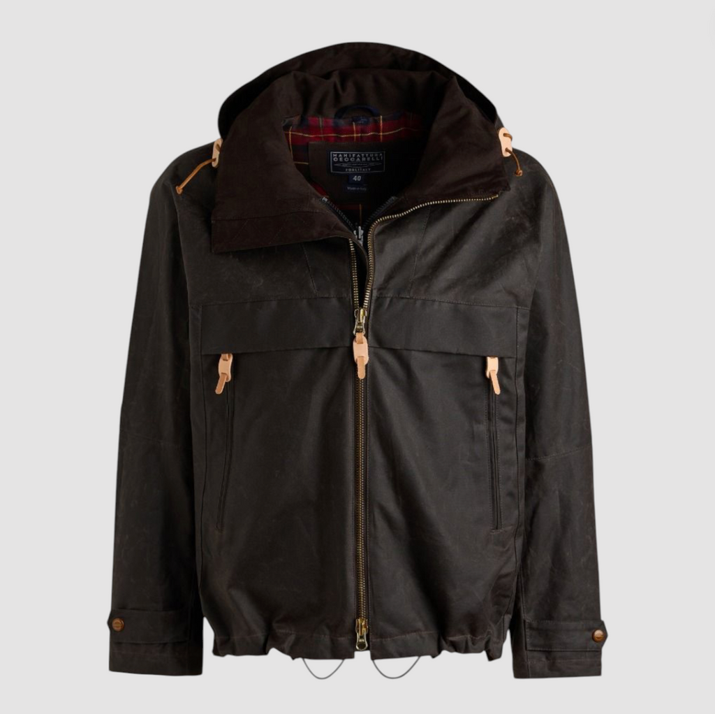 Brown wax jacket with hood and zip fastenings on a light grey background.