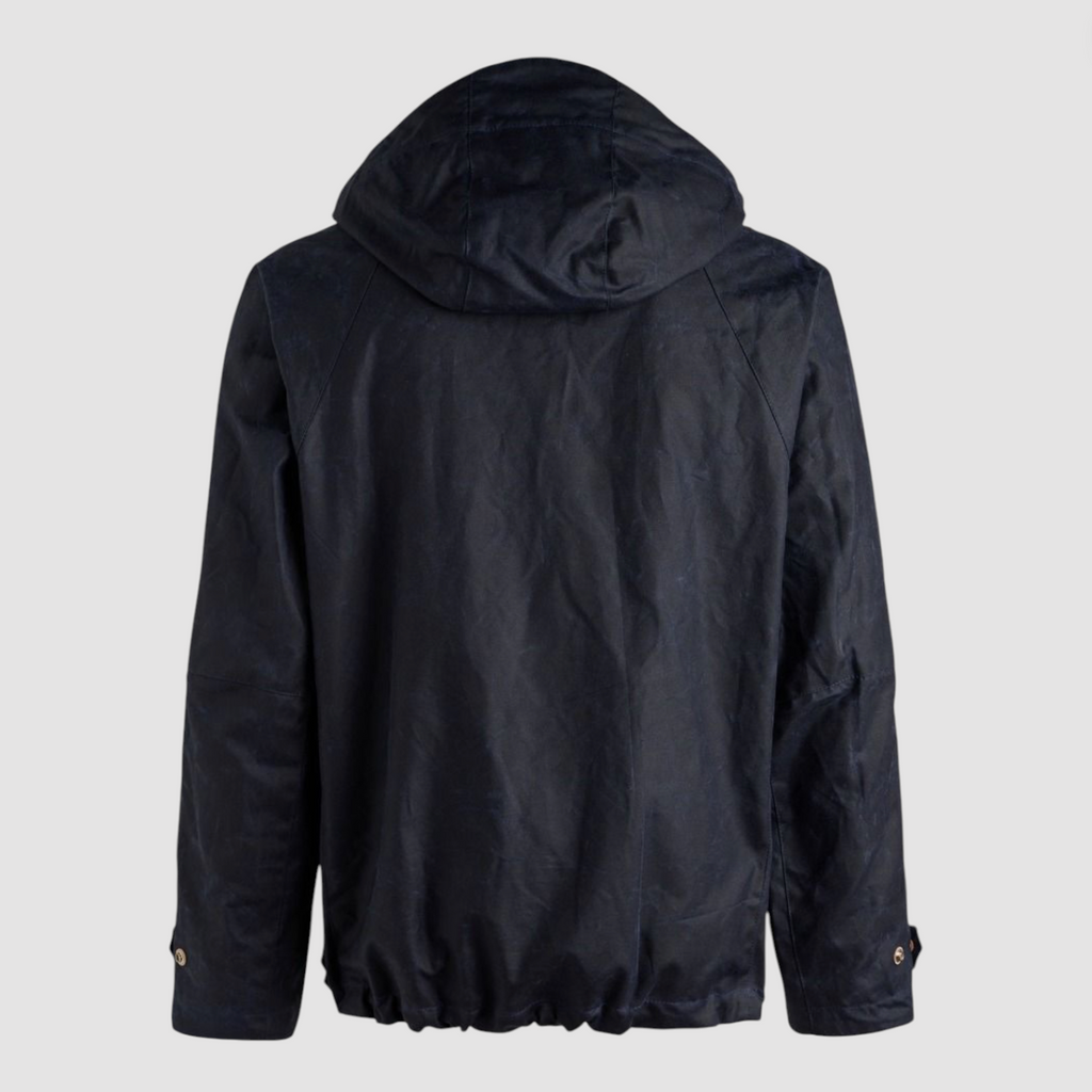 Navy wax jacket with hood on a light grey background.