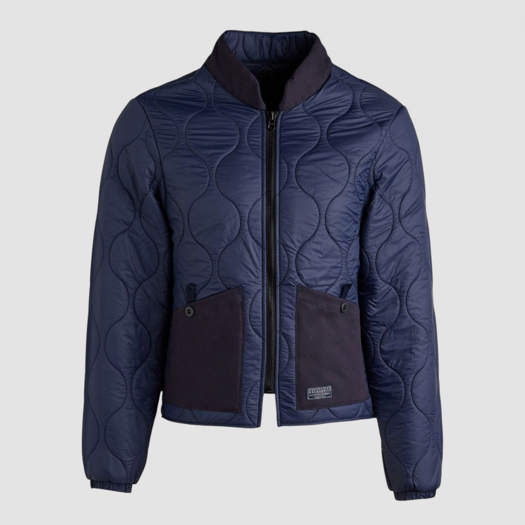 Navy zip-up liner jacket with pockets on a light grey background.