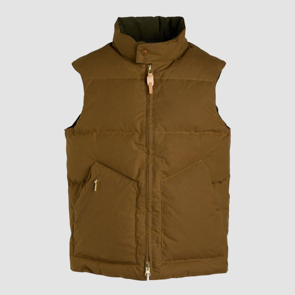 Brown puffer vest on a light gray background.