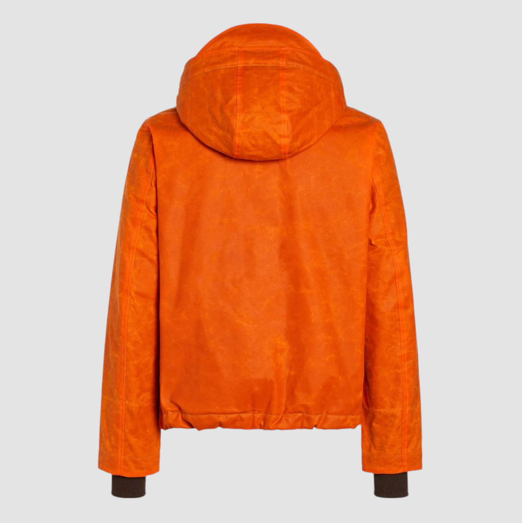 Orange water-repellent blazer coat made from paraffin cotton, featuring wool teddy lining, elastic cuffs, drawstrings, large dual-entry pockets, and branded details.