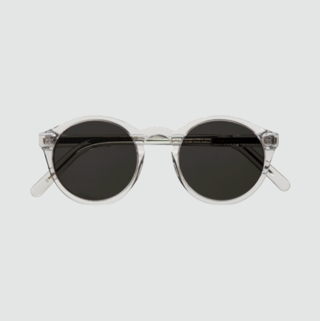 Monokel Barstow Crystal Sunglasses with grey lenses, handcrafted from organic acetate, featuring a keyhole nosebridge and Carl Zeiss Vision lenses.