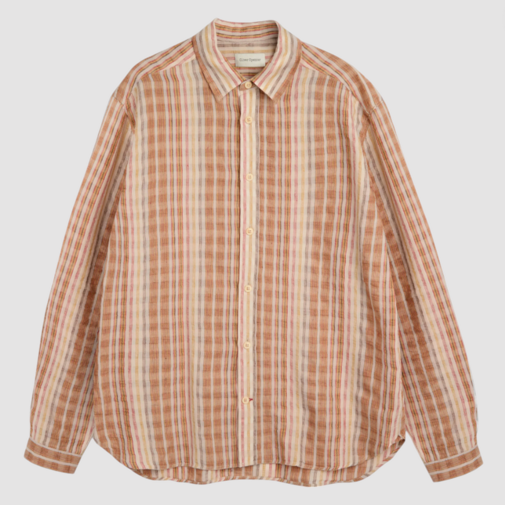 Multi-colored oversized long-sleeve shirt in lightweight cotton-linen seersucker, featuring a spear collar, front patch pocket, curved hem, and contrast gusset.